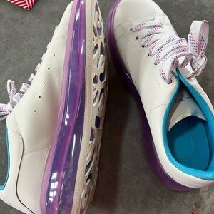 Stylish White Sneakers with Purple Soles